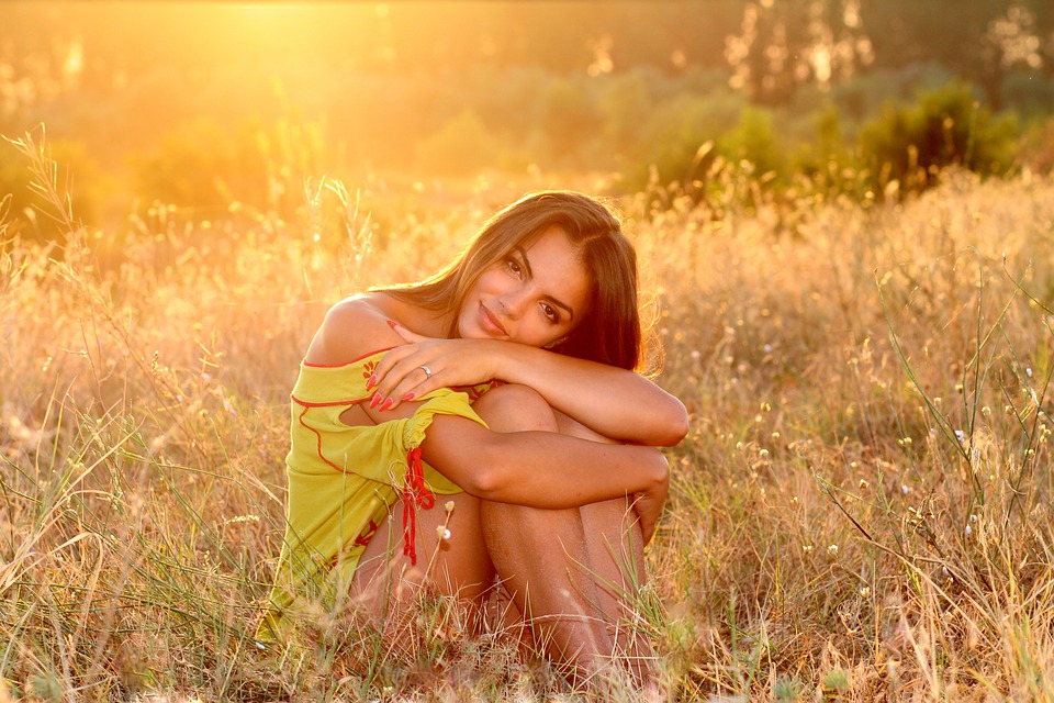 beautiful girl sitting on grass